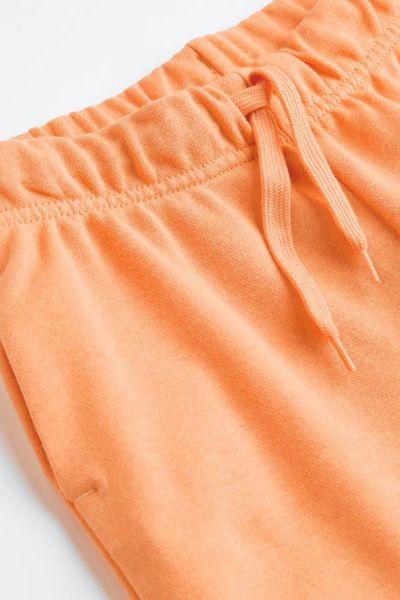 Спортивні брюки H&M пд8562 помаранчеві 158 2200000250360 фото